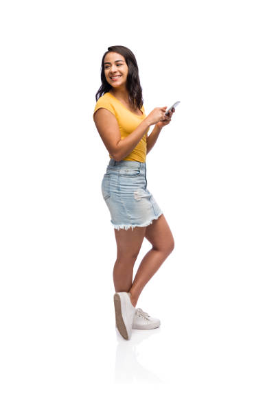 istock Young woman looking back and texting 1149088330