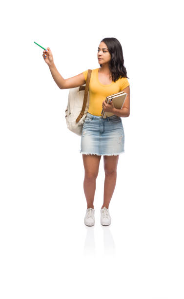 istock Serious college girl pointing to a copy space 1149088333