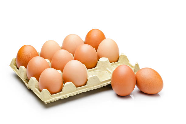istock Dozen eggs in a carton isolated on white background 1149089709