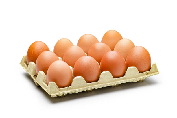 Dozen eggs in a carton isolated on white background