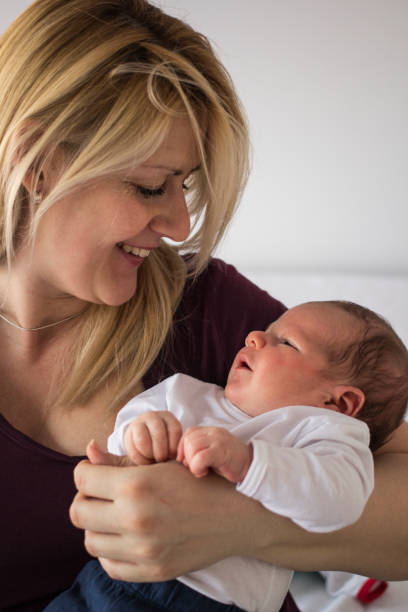 istock Newborn baby boy with his mother 1149089724