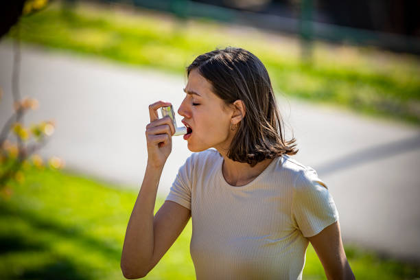 istock Woman Using Asthma Inhaler Outdoor 1149089767