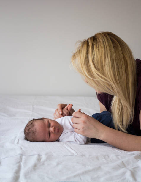 istock Newborn baby boy with his mother 1149090301
