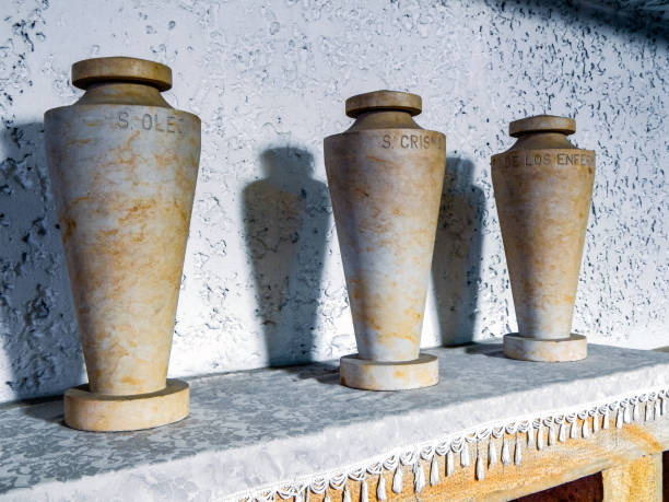 istock Three urns on top of a platform inside a church 1149090517