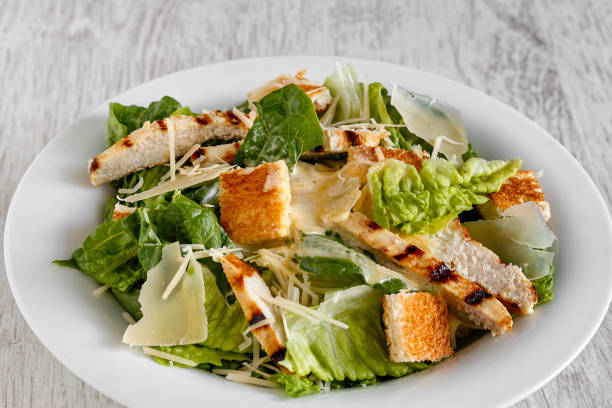 istock Caesar salad with chicken and cheese 1149091260