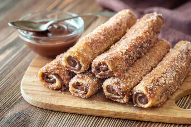 French toast roll-ups French toast roll-ups on the wooden board french toast stock pictures, royalty-free photos & images