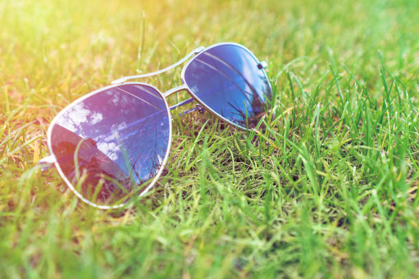 istock Soft focus, sunglasses on the green grass, summer mood. 1149096286