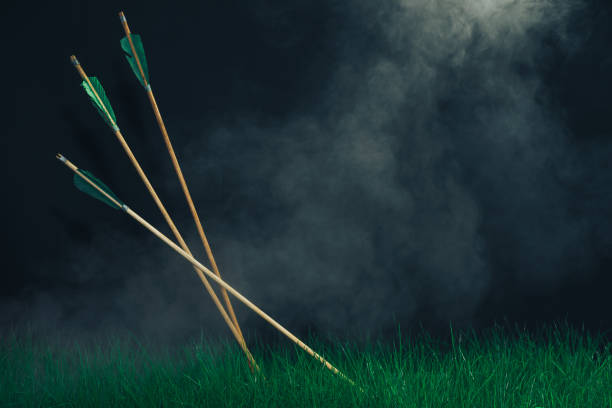 istock Three wooden arrows in the grass. Beautiful smog background. Medieval weapons handmade. 1149096700
