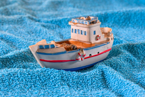 istock Ship souvenir on a towel - cruise concept 1149096955