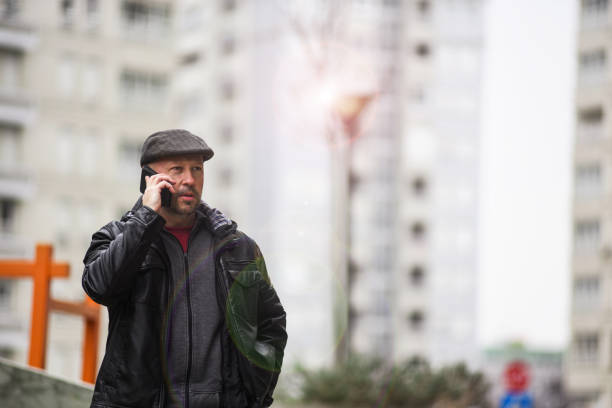 istock A middle-aged man with a mobile phone 1149097845