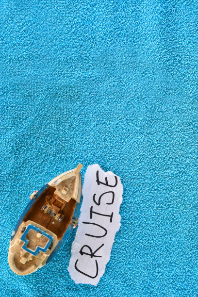 istock Ship souvenir on a towel with CRUISE note with a copy space - cruise concept 1149099457