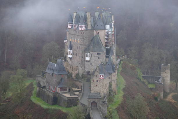 Burg Eltz, Germany - August 12, 2014: tourists in Castle Eltz above Mosel river, Germany. The castle is still owned by a branch of same family that lived there in the 12th century, 33 generations ago
