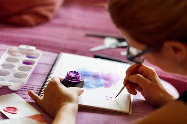 istock Artist painting patterns with watercolors 1149099981