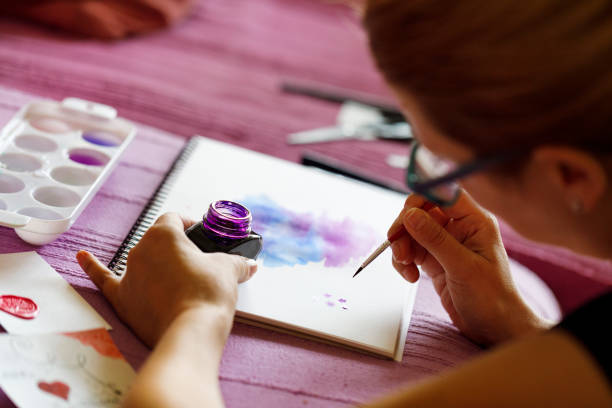 istock Artist painting patterns with watercolors 1149100141