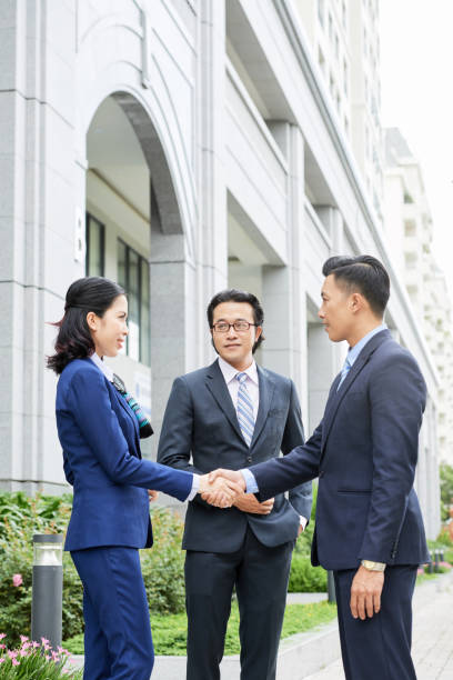 istock Business people shaking hands in the city 1149100165