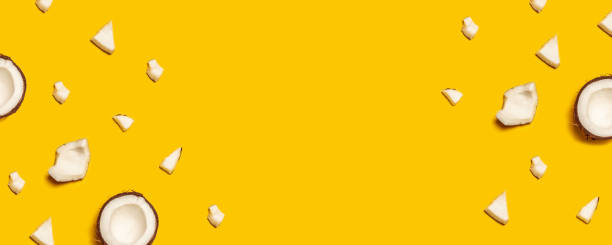 Tropical abstract coconut pattern on yellow background. Flat lay.