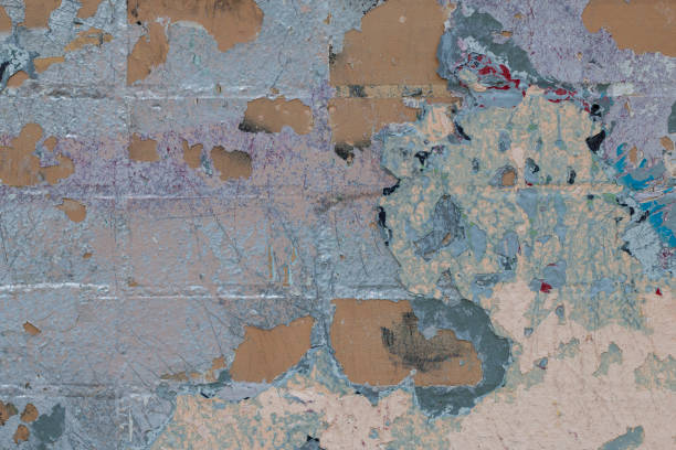 istock Brick wall with spots of old paint. Abstract textured background 1149101552