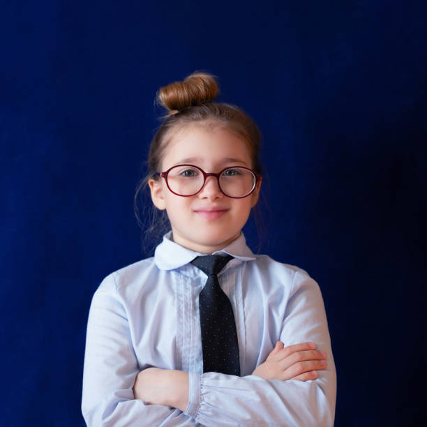 istock Diligent school student standing with crossed arms 1149102309