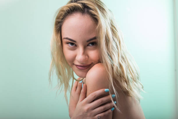 istock Young blond with curly hair and soft skin in studio 1149102425