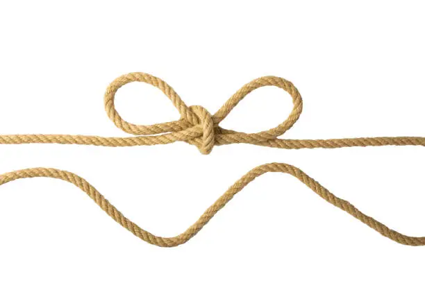 Rope isolated. Closeup of figure node or knot from two brown ropes isolated on a white background. Navy and angler knot or sailors knot.