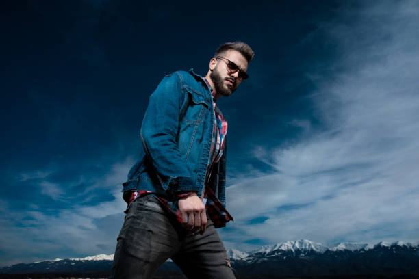 istock serious attractive young man walking  outdoor 1149107284
