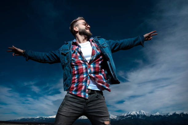 istock happy young casual man in a fly pose is dreaming 1149107294