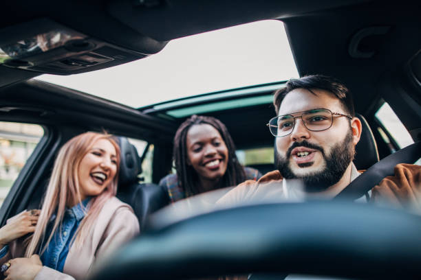 istock Cheerful friends driving in a car 1149107560
