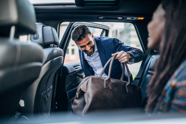 istock Young friends traveling by a car 1149107777