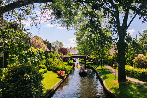 May 2017. Giethoorn. Netherlands. View of famous typical Dutch village Giethoorn with canals . The beautiful houses and gardening city is know as \