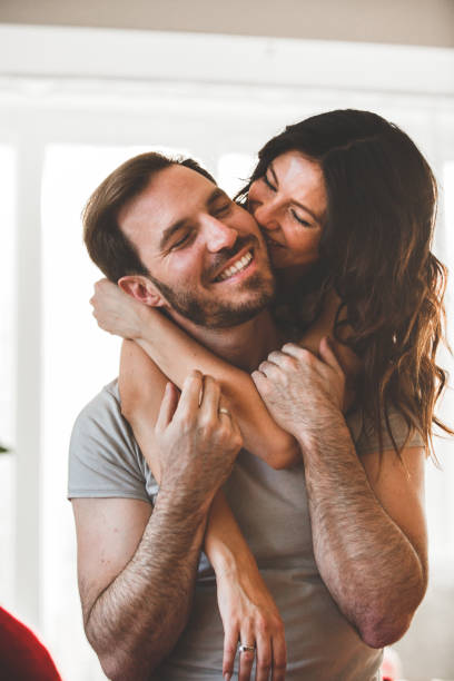 istock Woman kissing her husband 1149109059