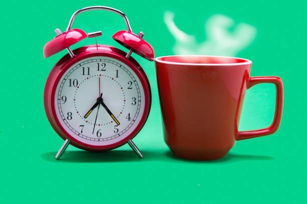 istock Delicious morning beverage with alarm clock. 1149109102