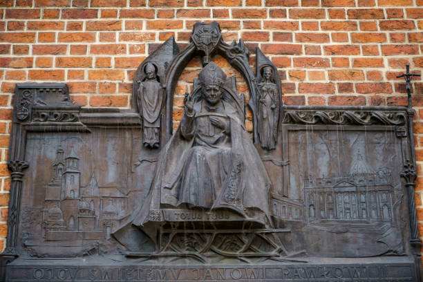 KRAKOW,POLAND-23 APRIL,2019: Monument of Pope John Paul (Janowi Pawowi II) born as Karol Jozef Wojtyla on building exterior in Krakow city