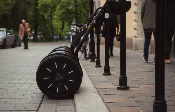 KRAKOW,POLAND-23 APRIL,2019: Modern electric segway for sightseeing tour.Ride on electric self-balancing board in European city.Fun ecological urban transport for tourists in summer day