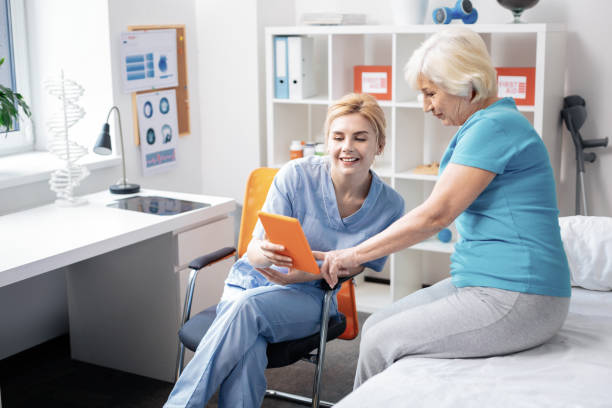 istock Joyful positive woman looking at the tablet screen 1149110052