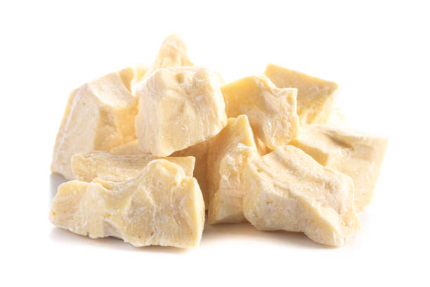 Chunks of Raw Organic Cocoa Butter Isolated on a White Background Chunks of Raw Organic Cocoa Butter Isolated on a White Background chocolate white chocolate chocolate chip white stock pictures, royalty-free photos & images