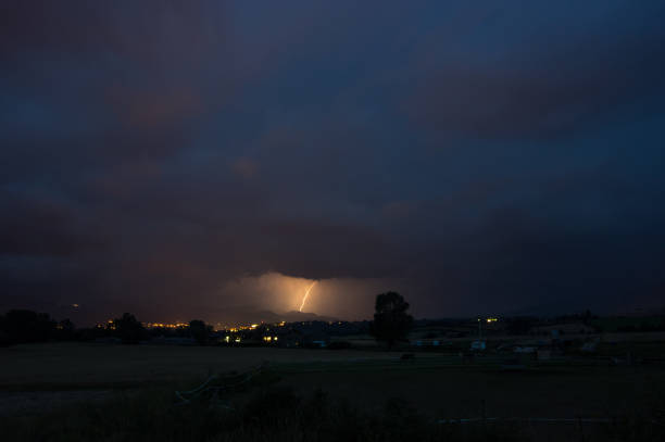 Thunderstorms and lightning up the sky in Cerdanya valley in Llivia, Girona, Catalonia, Spain llivia stock pictures, royalty-free photos & images