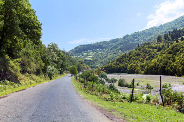 istock Deserted asphalt road in a mountain valley 1149113859