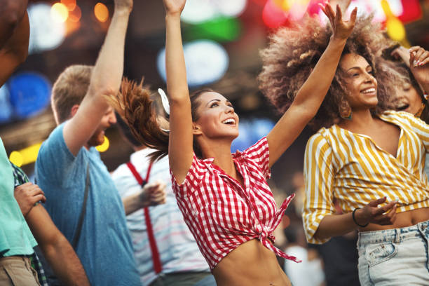 istock Friends dancing at a concert. 1149114244