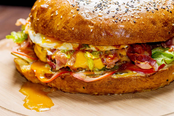 istock big fat burger with juicy stuffing on the cutting board 1149115500