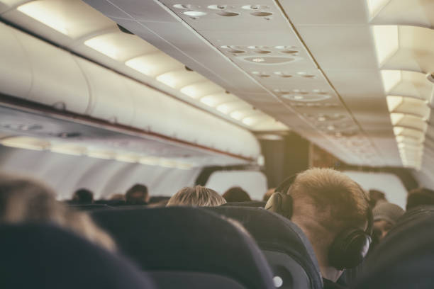 istock Interior inside of the plane with passengers. 1149115893