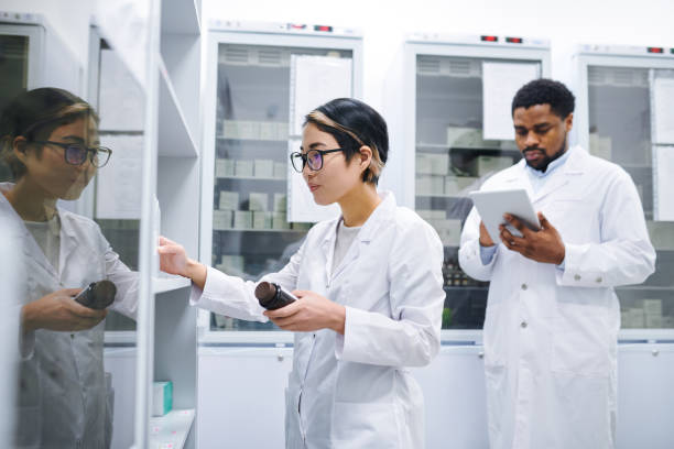 istock Asian pharmacist sorting medications in storage room 1149117457