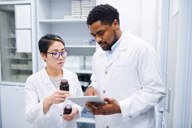 istock Pharmacists discussing new medications 1149117464