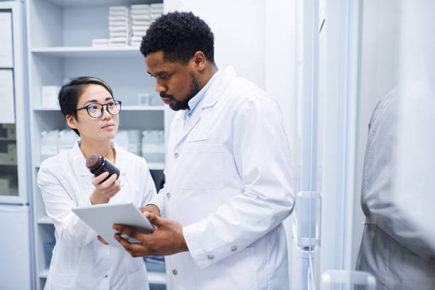 istock Medical assistant asking doctor about pills 1149117474