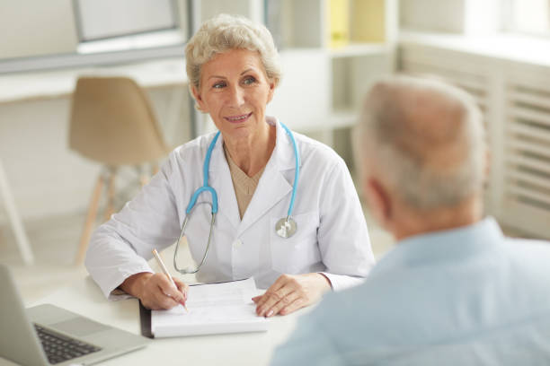 istock Smiling Senior Doctor 1149118887