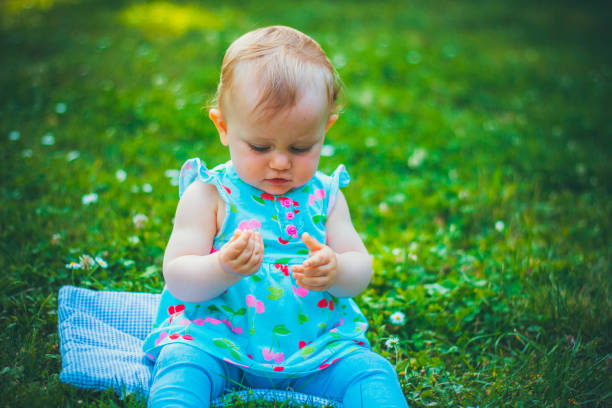 istock Little girl on grass 1149121001