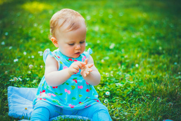 istock Little girl on grass 1149121225