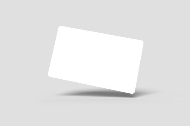 Credit Card or Business Card Blank white credit card floating on angle or blank business card floating on angle credit card stock pictures, royalty-free photos & images