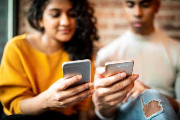 Sending money. Friends sending money through digital wallet mobile payment photos stock pictures, royalty-free photos & images