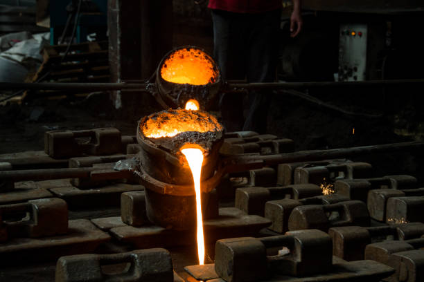 istock metal casting process with red high temperature fire in metal part factory 1149125685