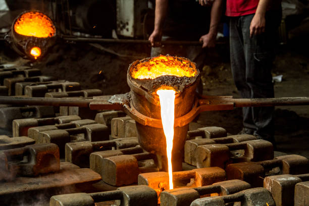 istock metal casting process with red high temperature fire in metal part factory 1149125703